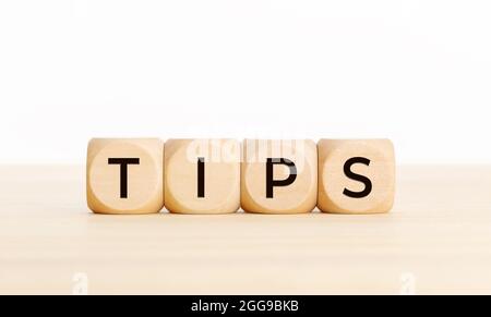 TIPS word on wooden blocks on table. Copy space Stock Photo