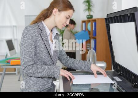 office worker using the photocopier machine Stock Photo