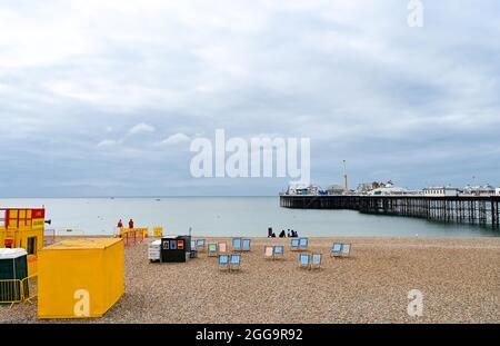 Brighton UK 30th August 2021 - Brighton beach is quiet on an overcast August bank holiday Monday morning .  : Credit Simon Dack / Alamy Live News Stock Photo