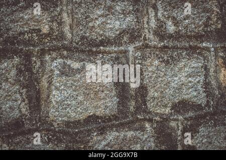 Old Temple wall. Rectangular cut out marble granite brick real surface stone with cement. Pattern gray color rustic texture background. Design website Stock Photo