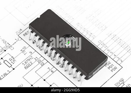 A reprogrammable microcircuit with electrical recording and UV erasure lies in the circuit diagram. Stock Photo