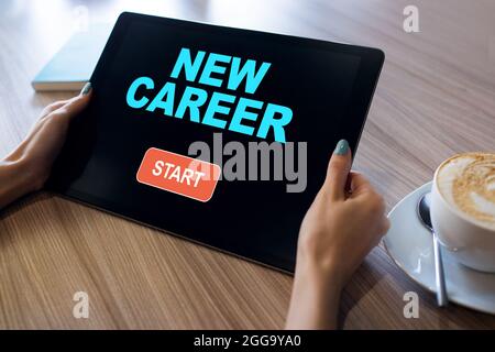 Start new career button on device screen. Recruitment and personal development concept Stock Photo