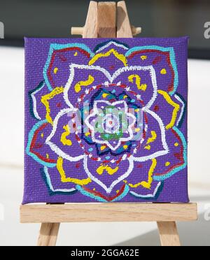 Mandala painted with multi-colored oil paints on canvas Stock Photo