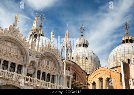 Artistic detail of the towers and domes of the Basilica of San Marco in Venice - Italian cities to visit and points of tourist and cultural interest Stock Photo