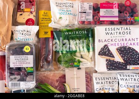 A selection of fresh foods wrapped in cardboard and plastic packaging from the UK supermarket Waitrose Stock Photo