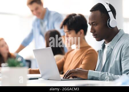 Colleagues working on a project using technology Stock Photo