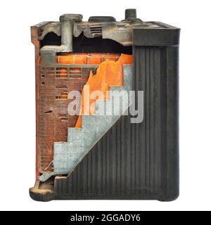 Old car battery with partly opened casing isolated on a white background Stock Photo