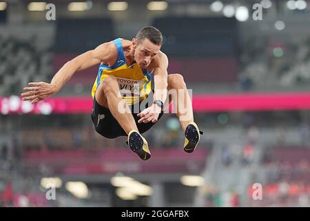 Tokyo, Japan. 30th Aug, 2021. Roman Pavlyk of Ukraine competes during the men's T36 class long jump final of athletics event at the Tokyo 2020 Paralympic Games in Tokyo, Japan, Aug. 30, 2021. Credit: Xiong Qi/Xinhua/Alamy Live News Stock Photo
