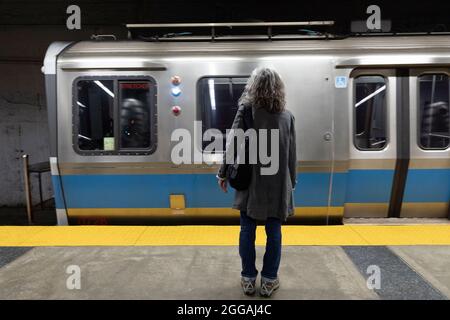 Woman subway train platform station Boston Massachusetts, USA Stock Photo
