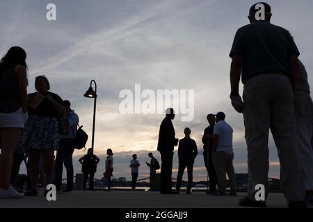 People talking silhouette dusk Boston Massachusetts Stock Photo