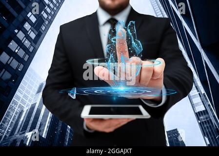 Man In Uniform Standing Holding Tablet And Virtually Tapping Screen. Business Man Carrying Pad Typing And Displaying New Futuristic Technologies. Stock Photo