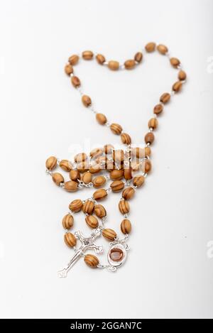 Christian souvenirs from the Holy Land Olive wood Rosary and crucifix on white background Stock Photo