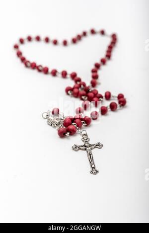 Christian souvenirs from the Holy Land Olive wood Rosary and crucifix on white background Stock Photo