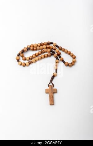 Christian souvenirs from the Holy Land Olive wood Rosary and crucifix on white background Stock Photo