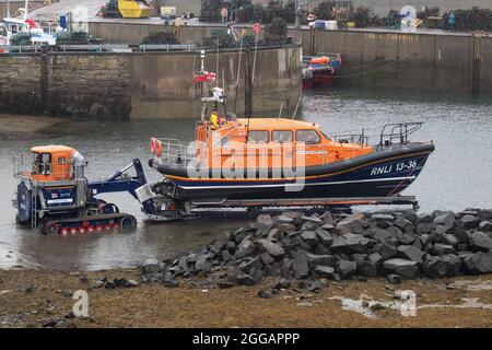 Shannon Class Lifeboat RNLB John and Elizabeth Allan is prepared for launching for a training exercise at Seahouses Harbour, North Sunderland, England Stock Photo