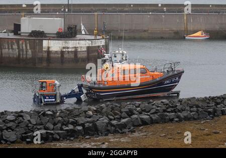 Shannon Class Lifeboat RNLB John and Elizabeth Allan is prepared for launching for a training exercise at Seahouses Harbour, North Sunderland, England Stock Photo