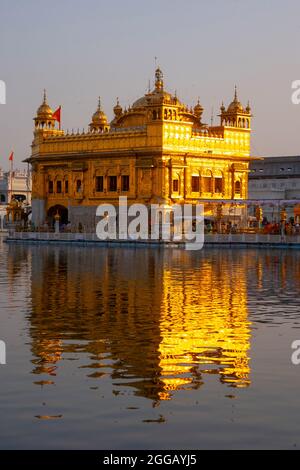 The Golden Temple (also known as Harmandir Sahib, lit. 'abode of God' or Darbār Sahib, meaning 'exalted court') is a gurdwara (place of assembly and w Stock Photo