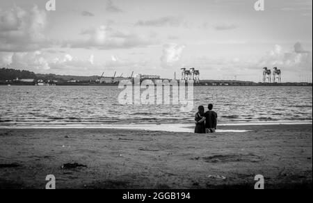 SUBIC, PHILIPPINES - Aug 01, 2017: A gray scale view of a Filipino couple dating at the beach of SMBA in Olongapo City Zambales Stock Photo