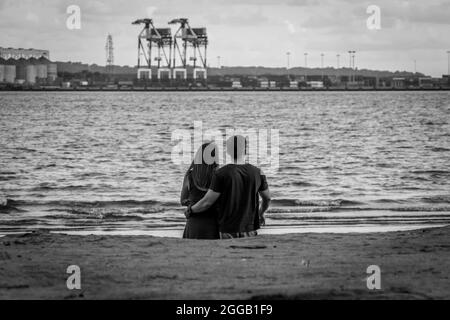 SUBIC, PHILIPPINES - Aug 01, 2017: A gray scale view of a Filipino couple dating at the beach of SMBA in Olongapo City Zambales Stock Photo