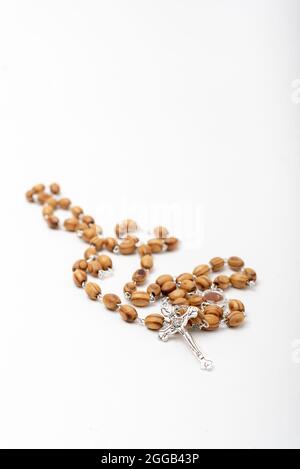 Christian souvenirs from the Holy Land Olive wood Rosary and crucifix on white background Stock Photo