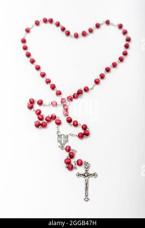 Christian souvenirs from the Holy Land Olive wood Rosary and crucifix on white background Stock Photo