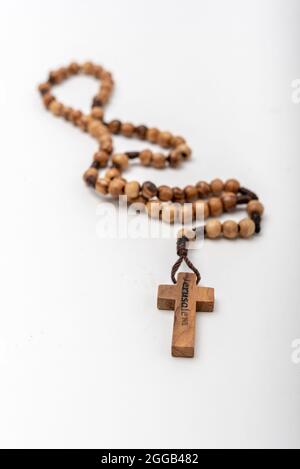 Christian souvenirs from the Holy Land Olive wood Rosary and crucifix on white background Stock Photo