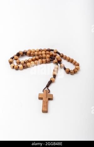 Christian souvenirs from the Holy Land Olive wood Rosary and crucifix on white background Stock Photo