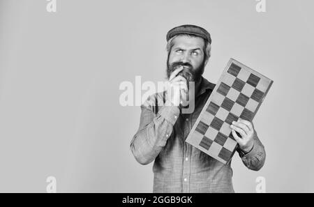 Man playing chess. back to school. chess pieces and board. competition success play. strategy, management or leadership concept. Playing chess on the Stock Photo
