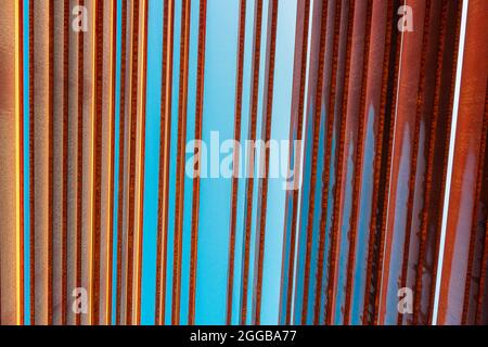 Rusty louvers against a blue sky, abstract orange and teal style image Stock Photo