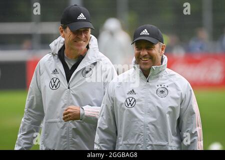 Federal coach Hans Dieter Hansi FLICK (GER) left: Oliver BIERHOFF (team manager GER). laughs, laughs, laughsd, optimistic, good-humored training national football team, World Cup qualification, on 08/30/2021 in Stuttgart. Stock Photo