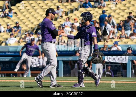 Colorado Rockies relief pitcher Carlos Estevez throws against the