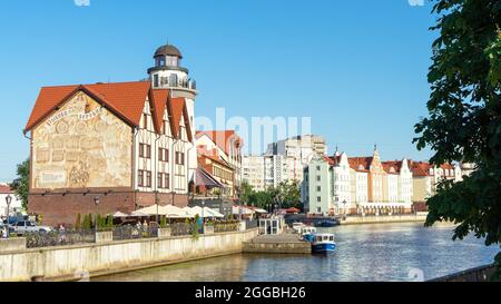 Fishing Village is ethnographic and trade-craft center in Kaliningrad, Russia on the banks of the Pregolya river. City quarter built up with modern bu Stock Photo