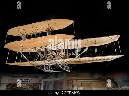 Canard biplane with one 30-to-40-horsepower Wright vertical four-cylinder engine driving two pusher propellers via sprocket-and-chain transmission system. No wheels; skids for landing gear. Natural fabric finish; no sealant or paint of any kind. The 1909 Wright Military Flyer is the world's first military airplane. In 1908, the U.S. Army Signal Corps sought competitive bids for a two-seat observation aircraft. Winning designs had to meet a number specified performance standards. Flight trials with the Wrights' entry began at Fort Myer, Virginia, on September 3, 1908. After several days of succ Stock Photo