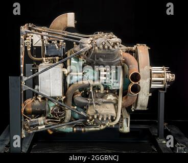 A direct-drive, liquid-cooled, supercharged, two-stroke cycle engine, this General Motors engine was a very unusual design incorporating four cylinder blocks, each containing two cylinder bores with a common combustion chamber. At least one application was a small radio controlled target aircraft, and it also powered an Oldsmobile Eight automobile. Flight testing by famed racing and test pilot Tony LeVier successfully continued through 1940 as high as 7.6 km (25,000 ft.) in a Cessna Airmaster C-165, but other pressing war priorities led to termination of the project. A 1942 engineering report Stock Photo