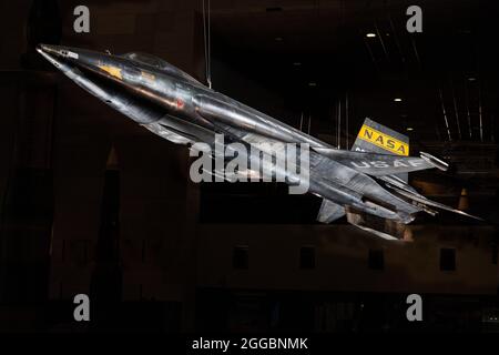 World's Fastest Piloted Aircraft. Piloted by Neil Armstrong. Bridged the gap between human flight in the atmosphere and spaceflight. North American X-15, rocket powered experimental aircraft; black titanium skin with wedge shaped horizontal stablizer; yellow stripe NASA inisignia on tail with stars and red bars United States national insignia on wings; white letter text &quot;U.S. AIR FORCE&quot; on the sides of the fuselage. Stock Photo