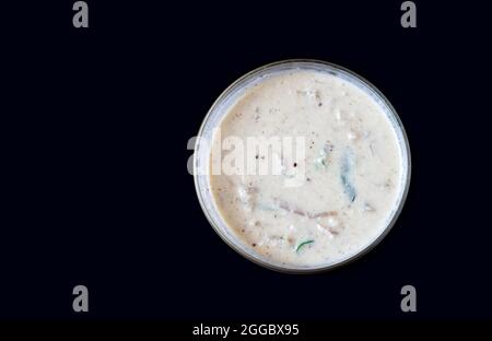 Closeup Image Of Kerala Special Side Dish Pachadi. Other Names Of Pachadi Dish Are Raitha, Olan, Kichadi. Black Background Stock Photo