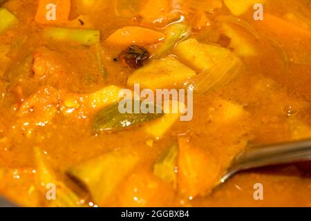 Closeup Image Of Kerala Special Traditional Vegetable Curry Sambar Making With Mixed Vegetables. Selective Focus Stock Photo