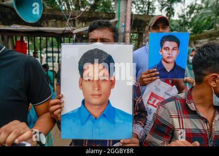 Relatives hold portraits of disappeared family members at an event to mark the International Day of the Disappeared, at National Press Club, in Dhaka, Bangladesh, on 30 August 2021. Families of the victims of enforced disappearance have demanded return of their loved ones on the International Day of the Victims of Enforced Disappearances. Mayer Daak, a platform of the families of the people who fell victim to enforced disappearance, organized a programme where relatives of disappeared people joined. (Photo by Suvra Kanti Das/Sipa USA) Stock Photo