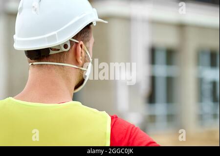 Caucasian dark-haired man examining a new construction object Stock Photo