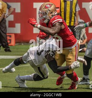 Santa Clara, United States. 29th Aug, 2021. San Francisco 49ers wide  receiver Deebo Samuel (19) is tackled by Las Vegas Raiders free safety Karl  Joseph (43) and linebacker Max Richardson (54) during