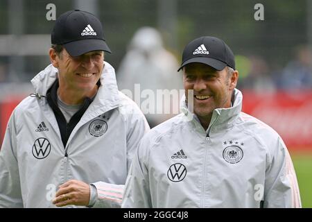 From right: Federal coach Hans Dieter Hansi FLICK (GER), Oliver BIERHOFF (team manager GER), laughs, laughs, laughsd, optimistic, in a good mood, training football national team, World Cup qualification, on 08/30/2021 in Stuttgart. Stock Photo
