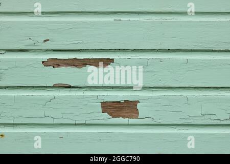 Peeling and cracked paint on wood panelling background with copyspace Stock Photo
