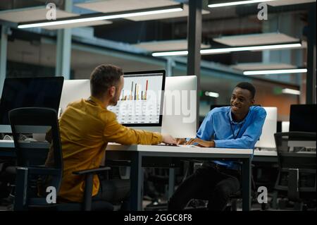 Employees works on computers, workplace in office Stock Photo