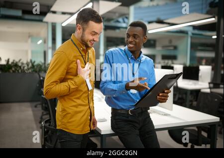 Two male employees, meeting in IT office Stock Photo