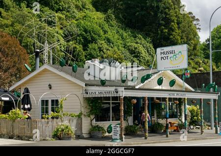 Havelock, Marlborough/New Zealand - November 23, 2014: Restaurant decorated with green-lipped mussel signs, Havelock, Marlborough Sounds, New Zealand. Stock Photo