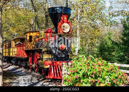 View of Antique Wood Burning Steam Engine and Coaches on a Beautiful Day Stock Photo