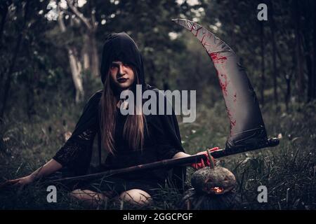 Portrait woman scary ghost in forest, halloween concept Stock Photo