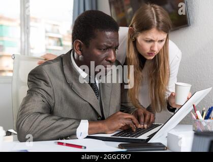 Focused coworkers working together Stock Photo