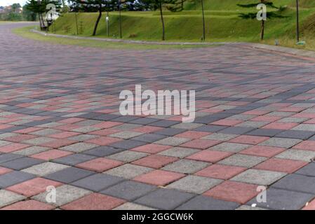 Paving stones. Concept of laying paving slabs and pavers. Paving stones. Concrete pavement blocks. can be used as background and wallpaper Stock Photo