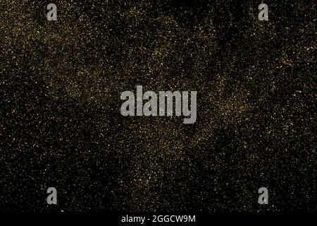 Gold Glitter Texture Isolated on Black Background. Golden stardust. Amber Particles Color. Sparkles Rain. Vector Illustration, Eps 10. Stock Vector